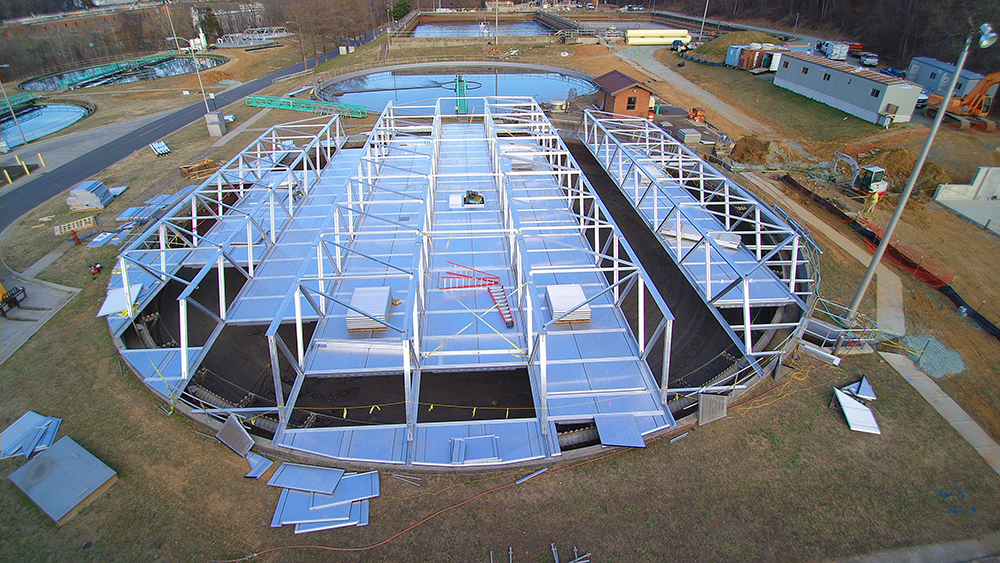Partial aerial of aluminum tresses covering clarifiers