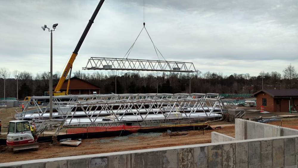 Crane carries aluminum tresses over clarifier #1 | Rivanna Authorities